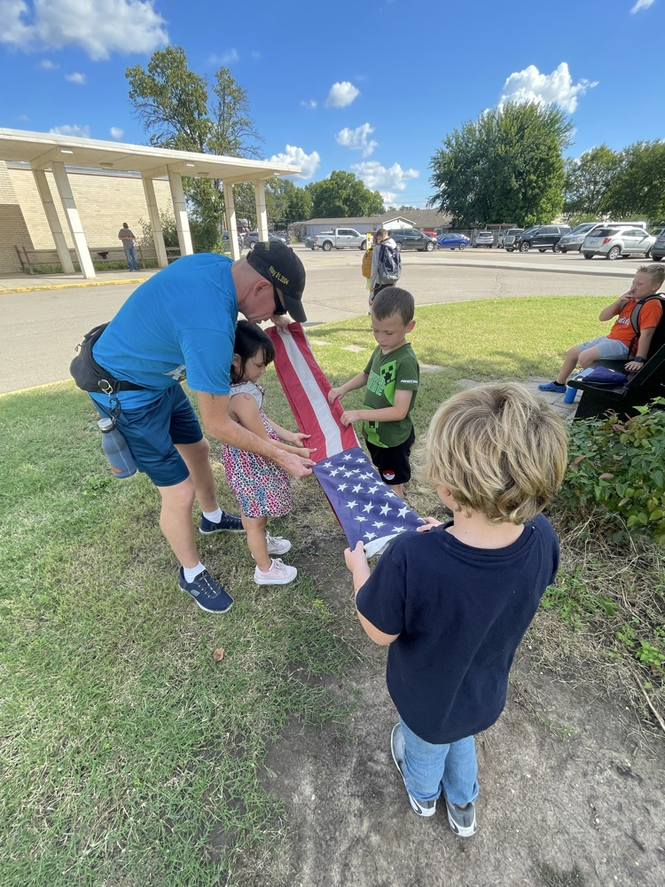 Folding the American flag.