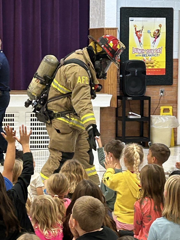 Firefighter giving high 5s