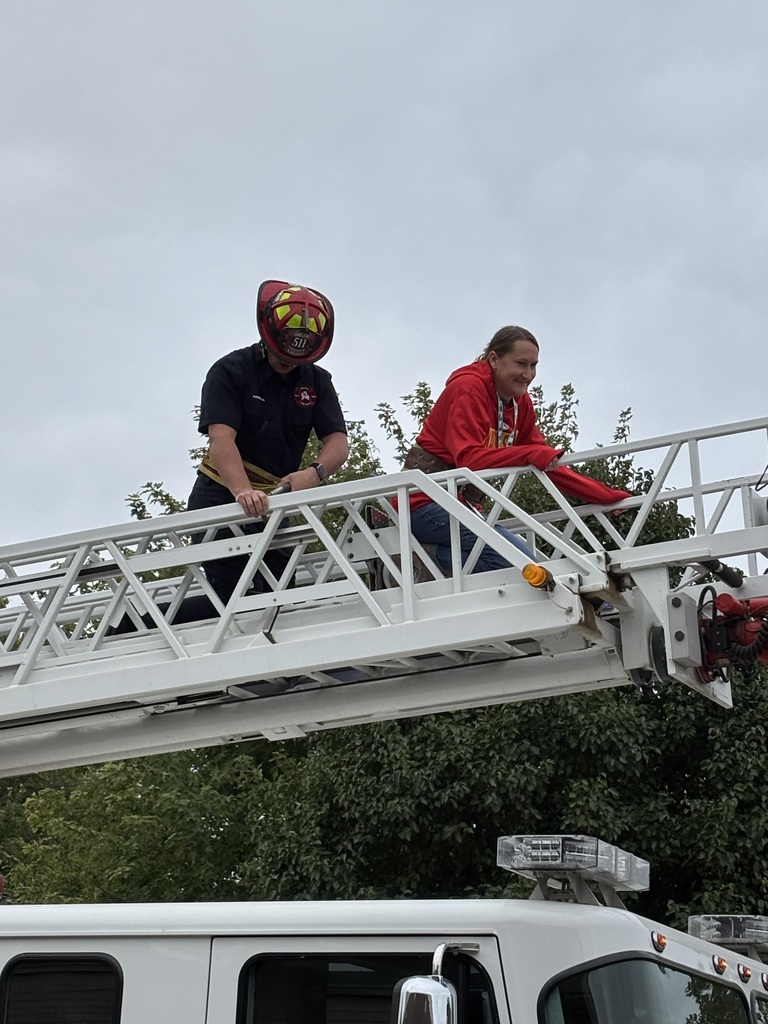 Mrs. Davies trying out the ladder.