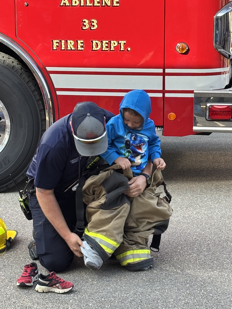 Child trying on pants.
