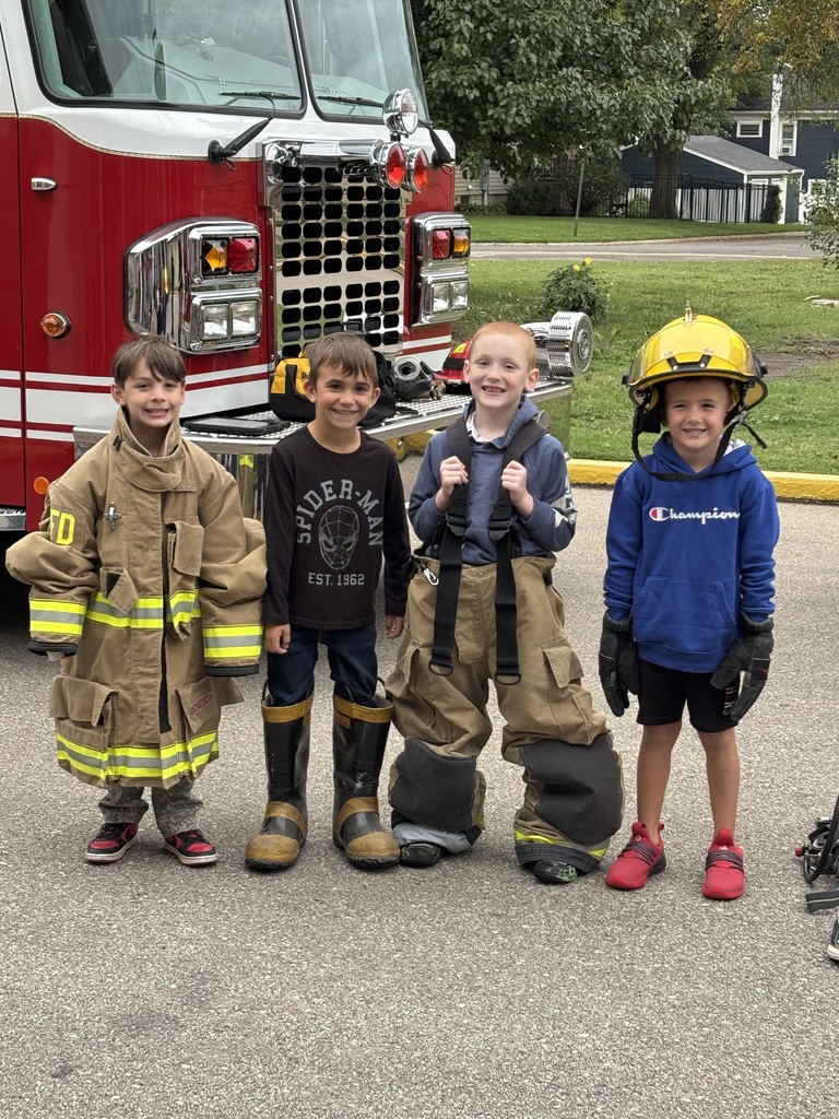 Students in firemen gear.