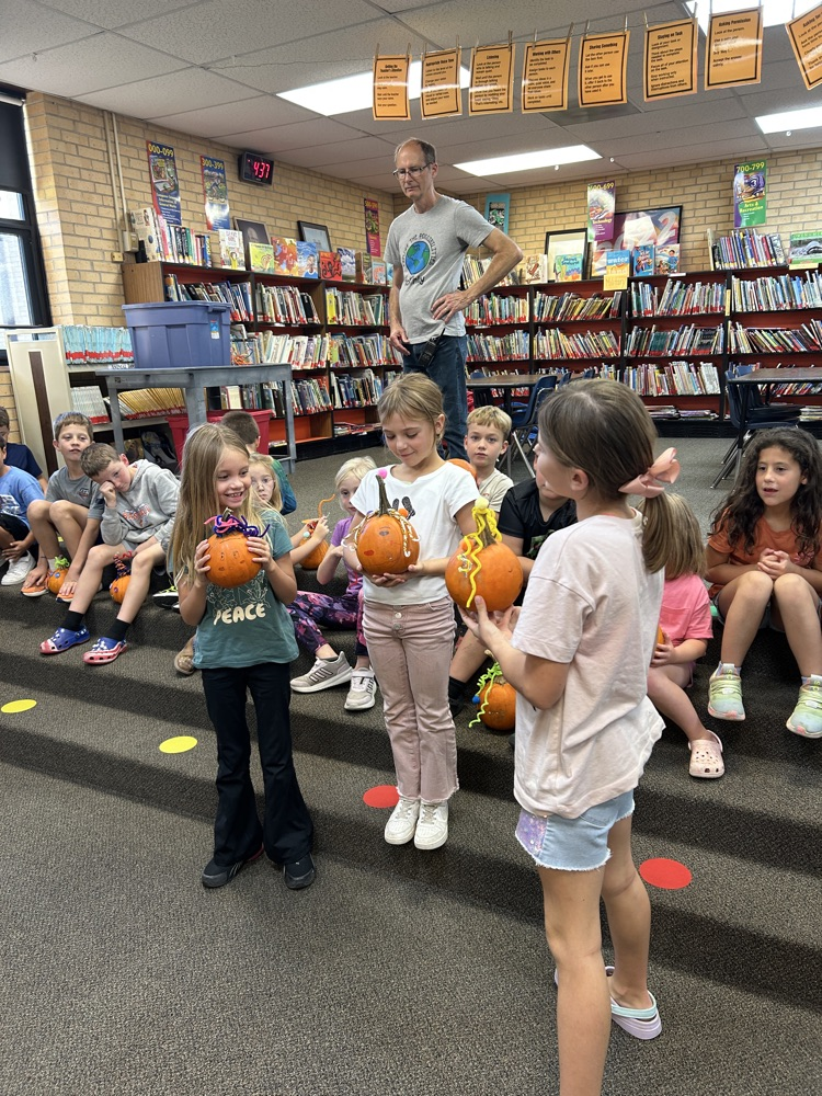 Presenting their pumpkins 