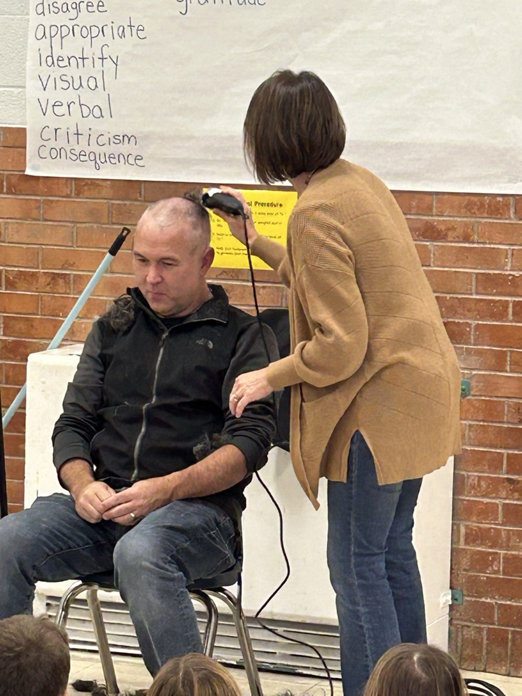Mr. Meneley shaving his head
