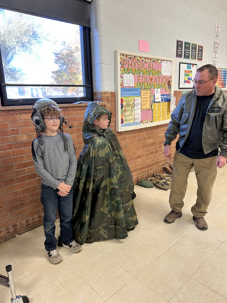 Trying on military gear