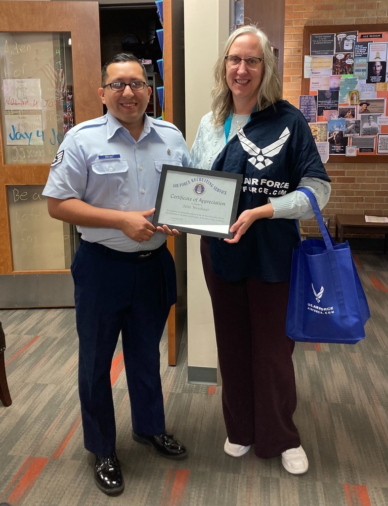 Woman receiving certificate from man
