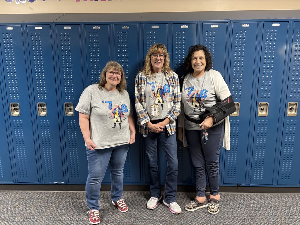 Staff wearing '76 shirts