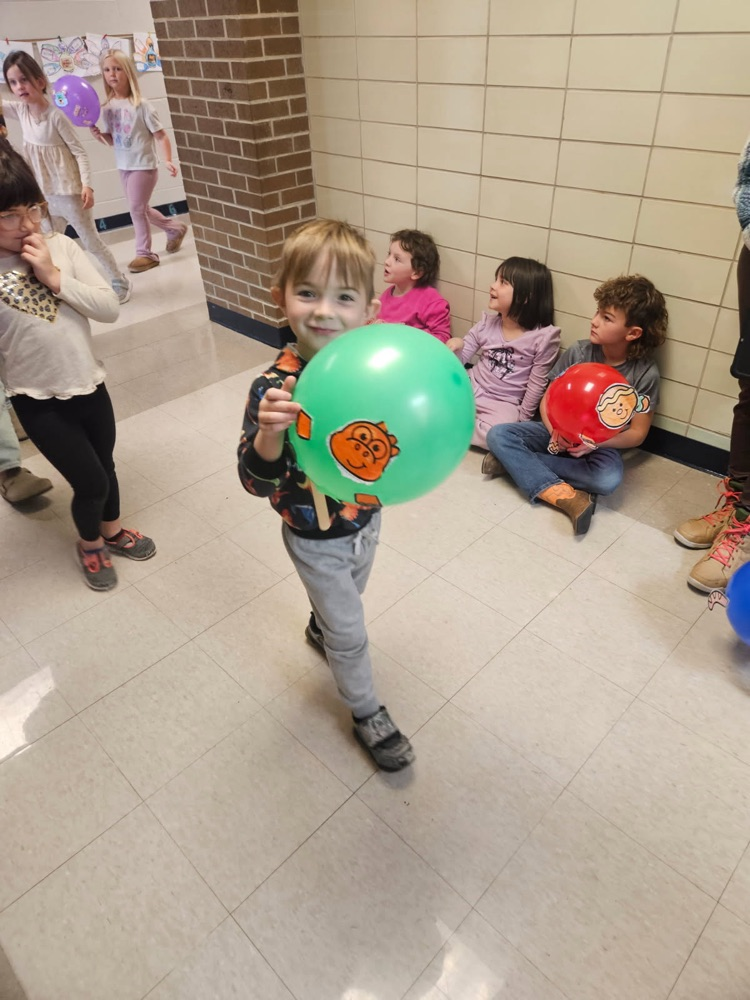Students parading with balloons.