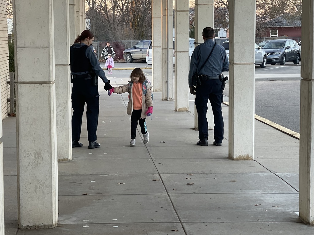 Students being greeted by officers.