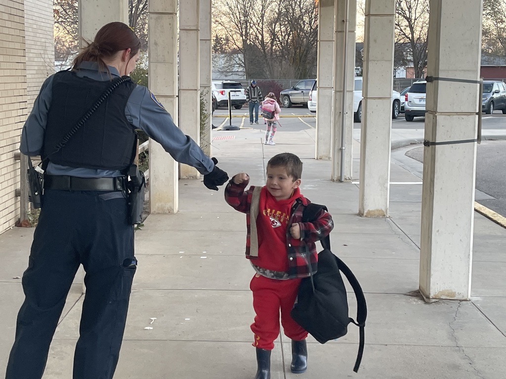 Students being greeted by officers.