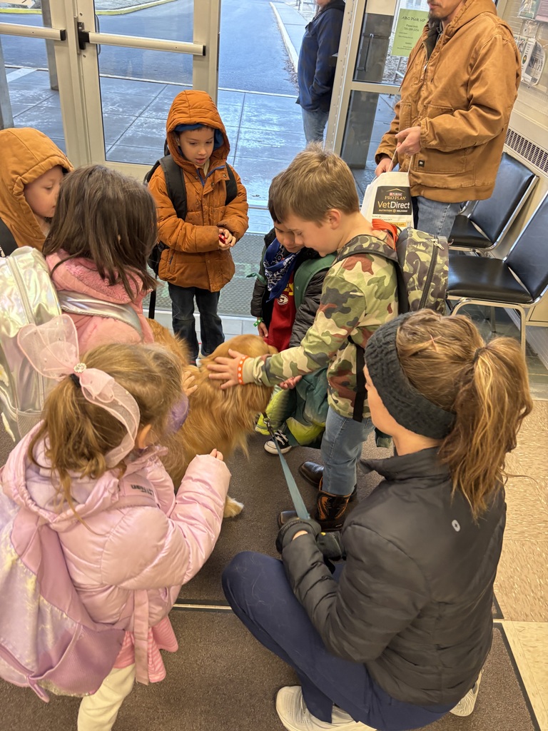 Rhett getting petted by students.