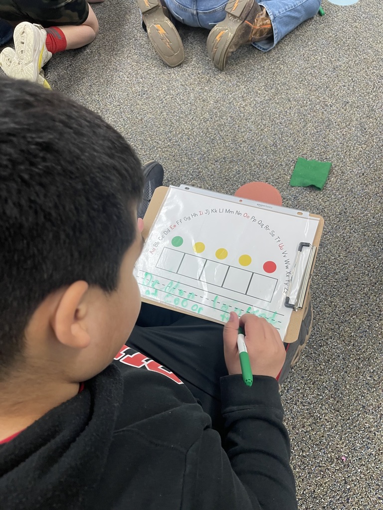 Boy learning to write sentences.