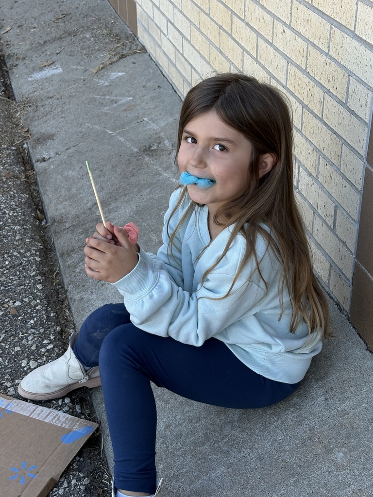 Student enjoying cotton candy.