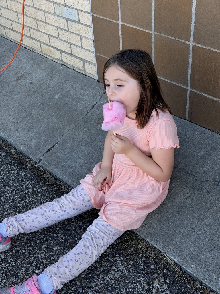 Student enjoying cotton candy.
