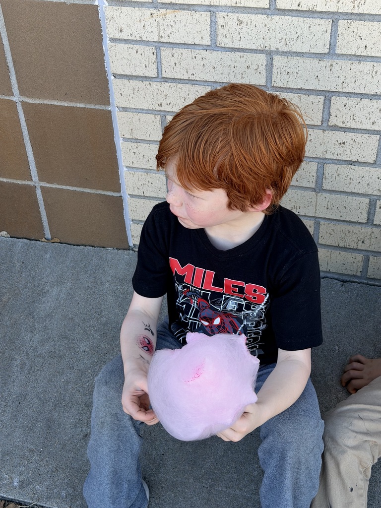 Student enjoying cotton candy.
