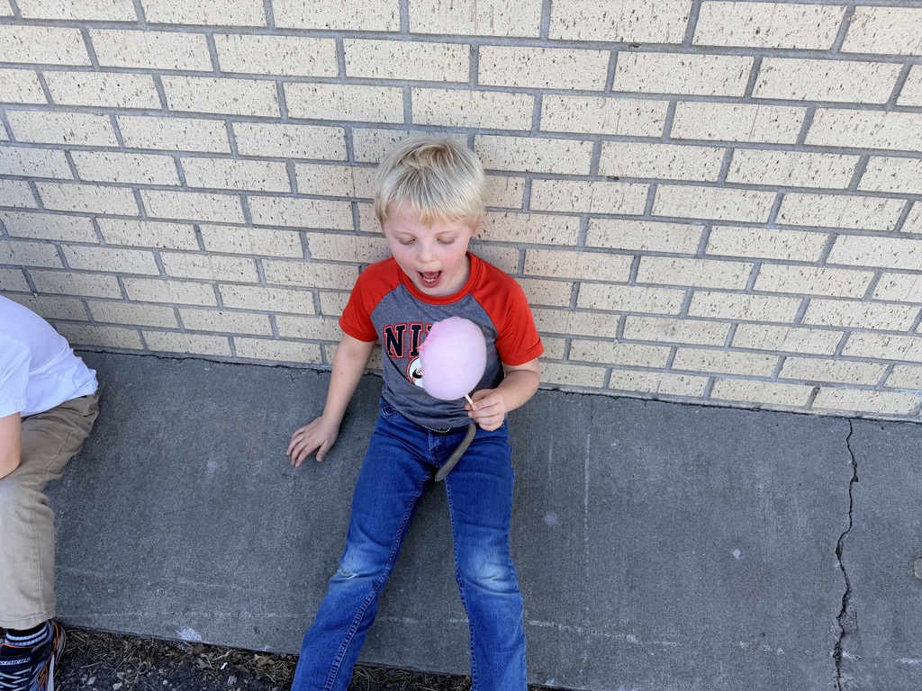 Student enjoying cotton candy.