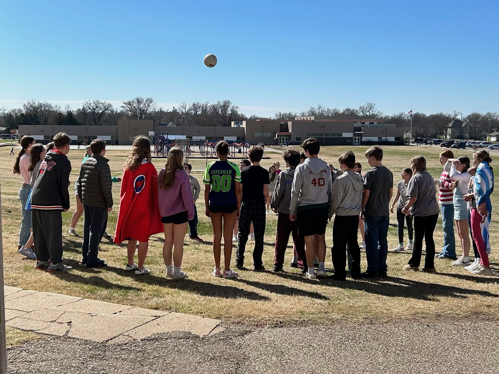 AMS Students play a game of volley the ball outside