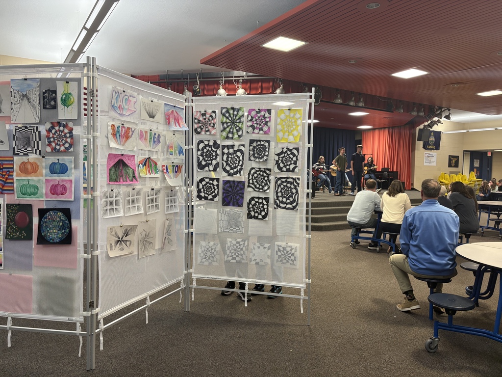 Art display with jazz band playing in the background