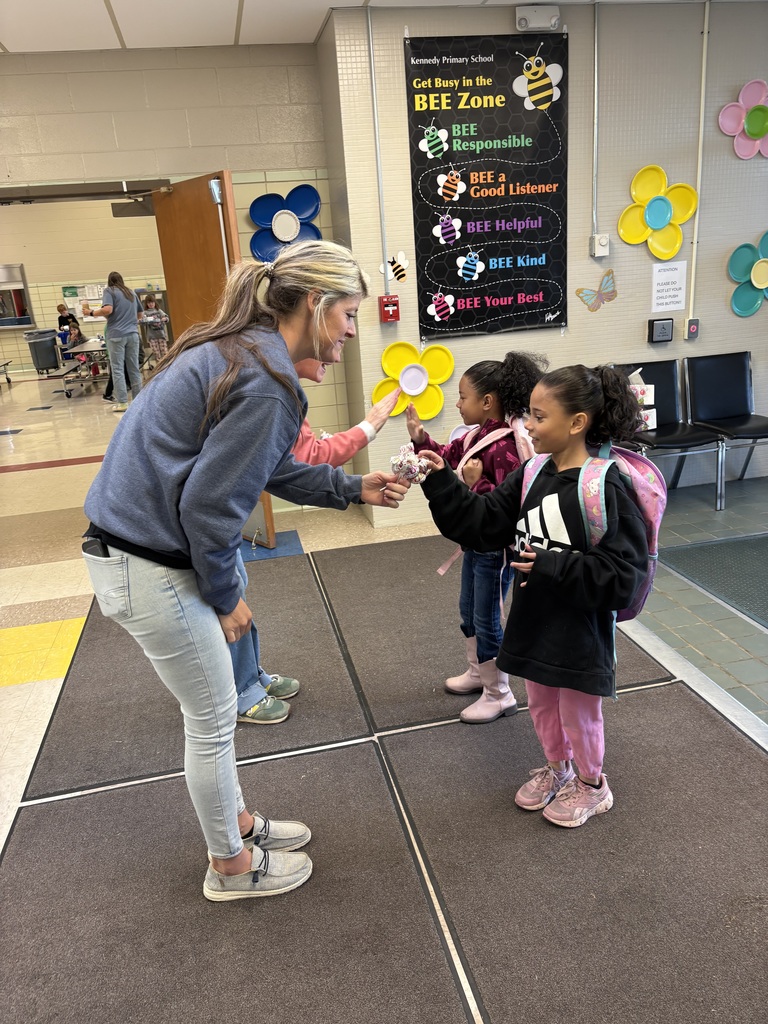 Amanda West high fiving students.