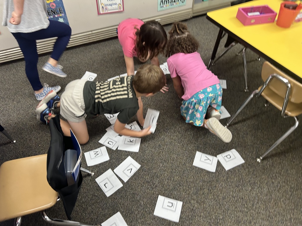 Mrs. Haslouer's class working together to put the alphabet in order.