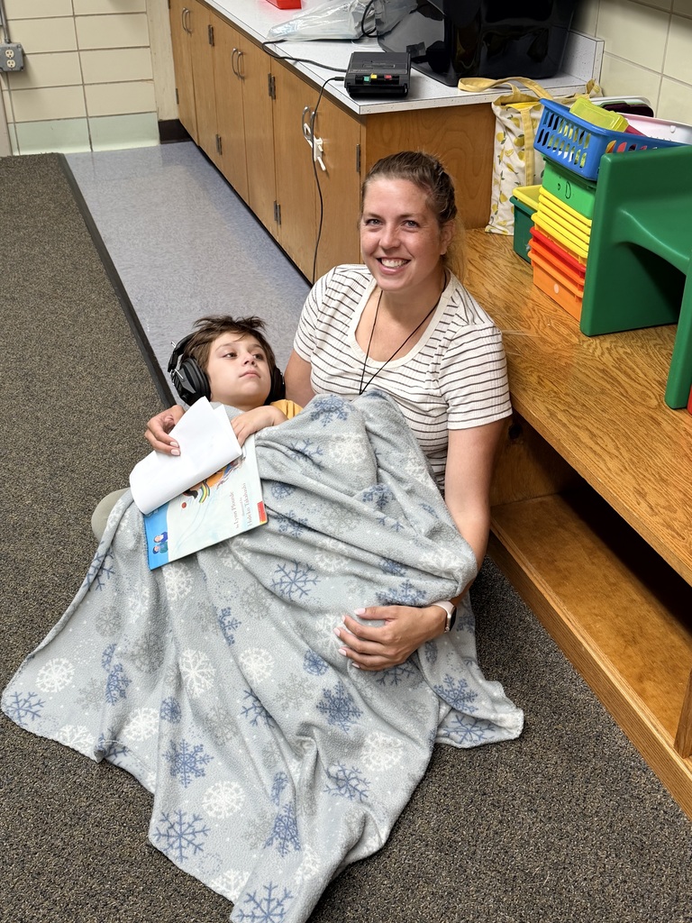 Mrs. Arnold comforting a student.