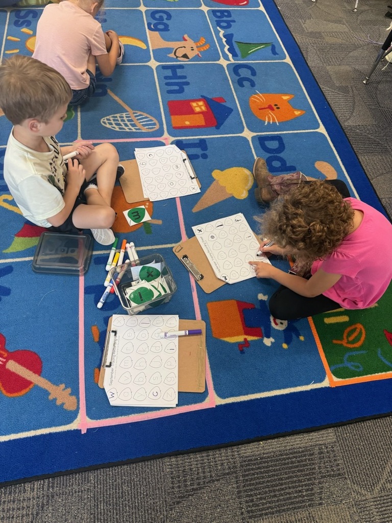 Mrs. Todd's class working on a letter activity.