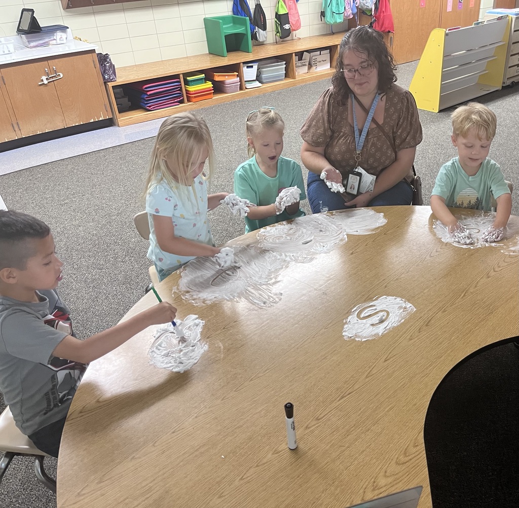Mrs. Arnold's group practicing their letters in shaving cream!