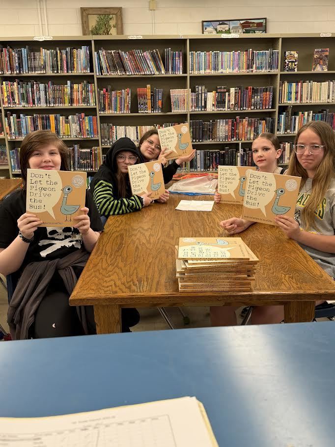 Interactors putting labels in the books
