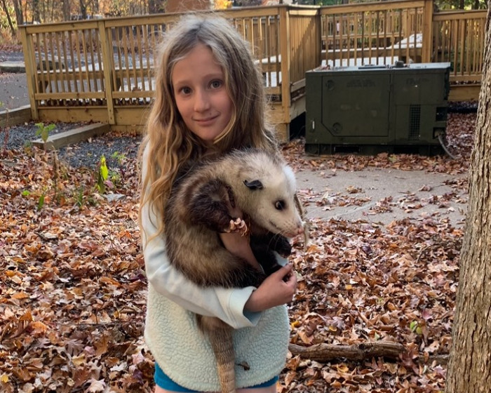 Emily Nagy holding a possum