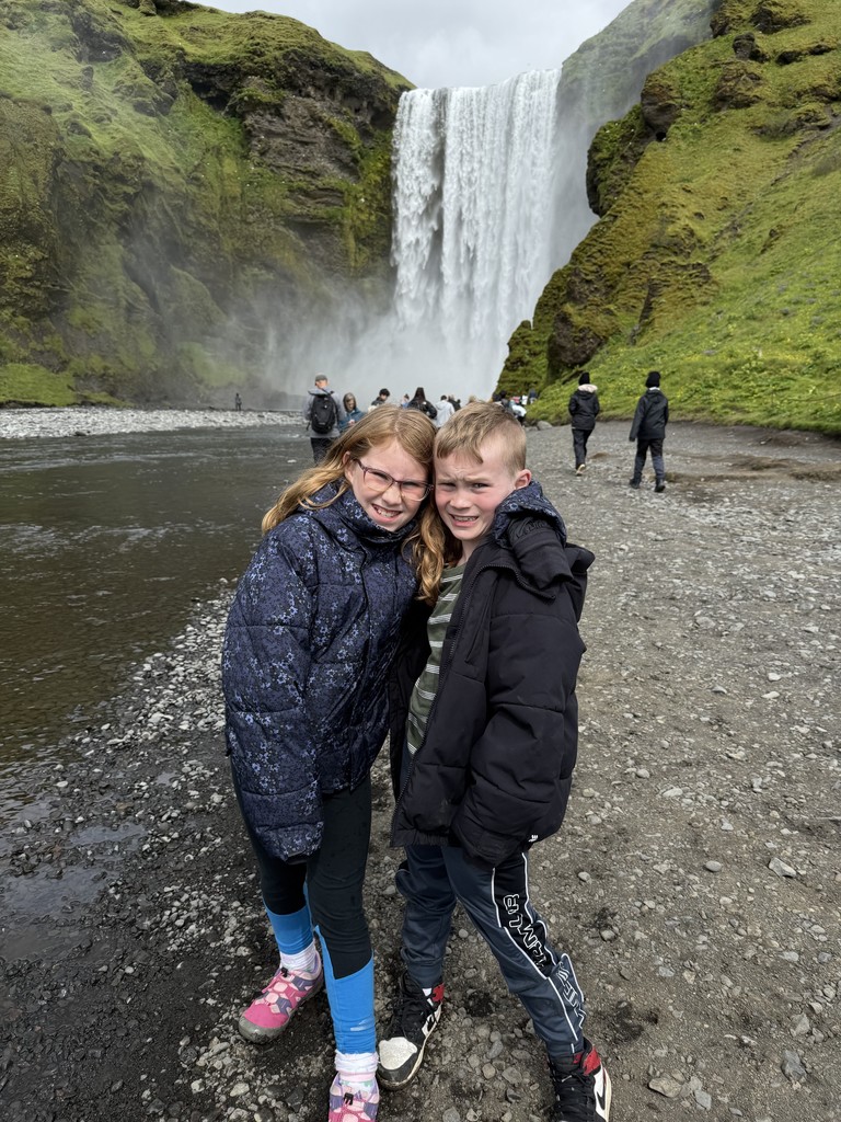 Mara and Eddie visiting waterfalls during their trip to Iceland
