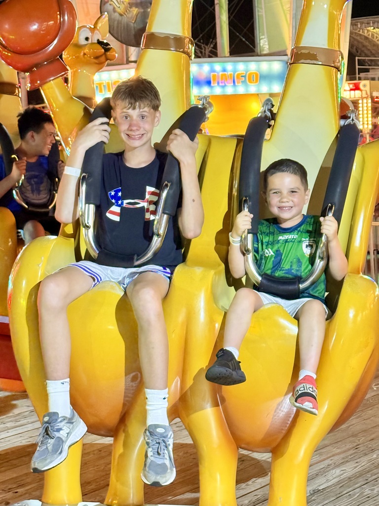 AMS student and his young cousin enjoy an amusement ride in Wildwood, NJ