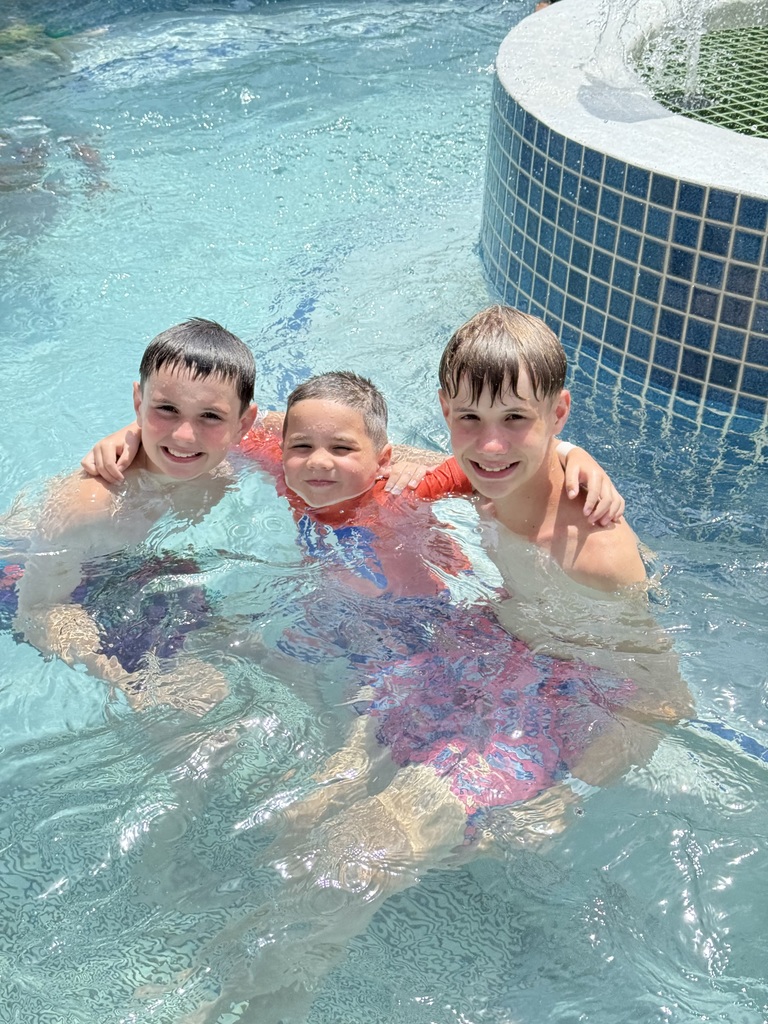 3 cousins enjoy swimming in a pool while vacationing in Wildwood, NJ