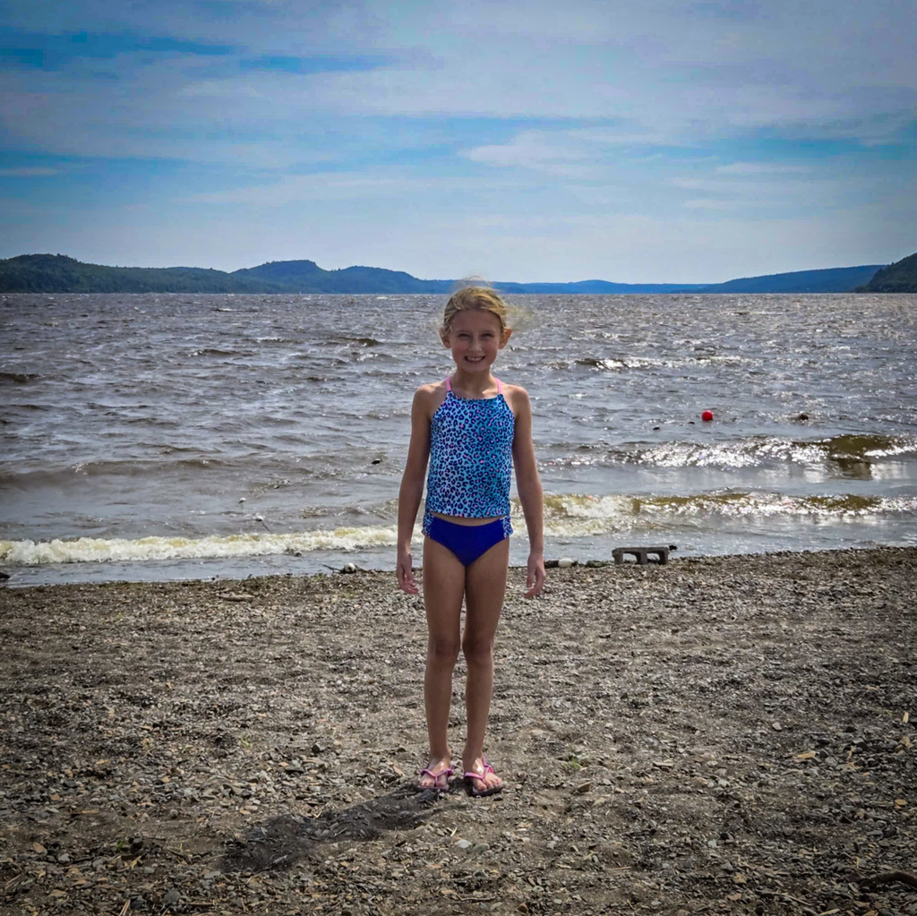 Alexis standa on the shore of the St. John River in Canada
