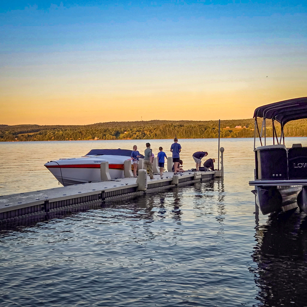 Henry, Alexis and their famility on a pier on the St. John River in Canada