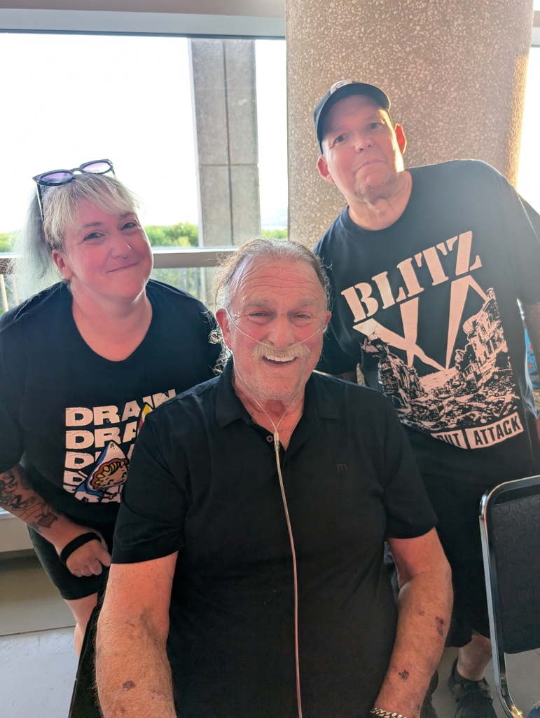 Ms. Kristy Davis and Mr. Jamie Davis pose with their favorite wrestler, Jake "The Snake" Roberts
