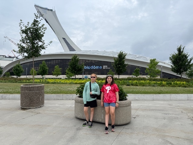 Audra and Elena stand in front of the Biodôme, an indoor natural science museum