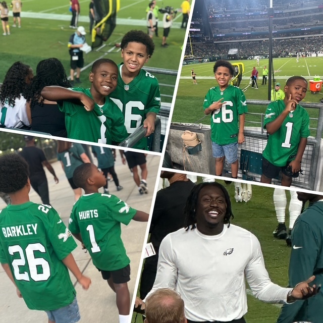 Avery and Quinn having a great time  at the football game in Philadelphia, wide receiver AJ Brown smiling with his hands extended