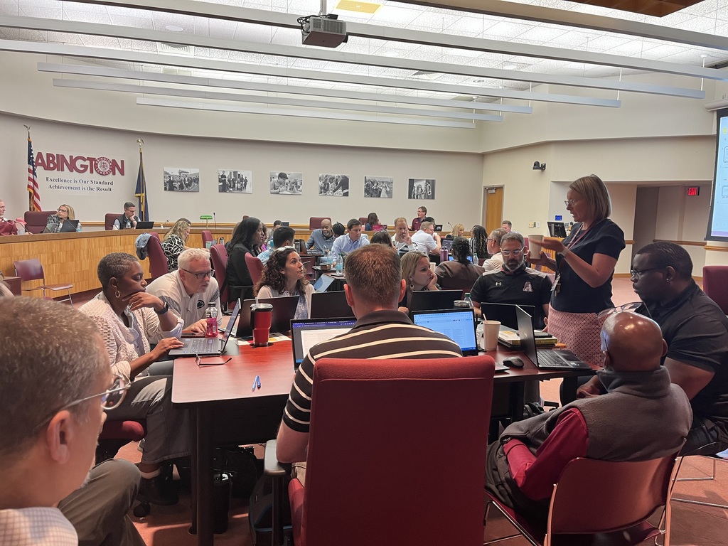 Ms. Laura Enama discusses with the high school team during breakout time