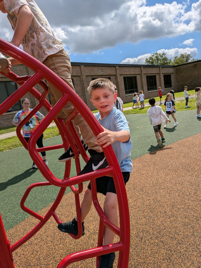 Student climbs a slide at McKinley