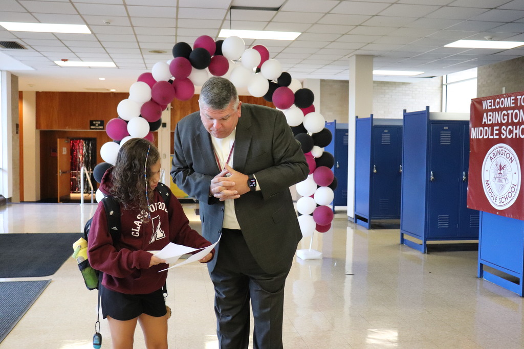 Mr. File helps direct a 6th grader