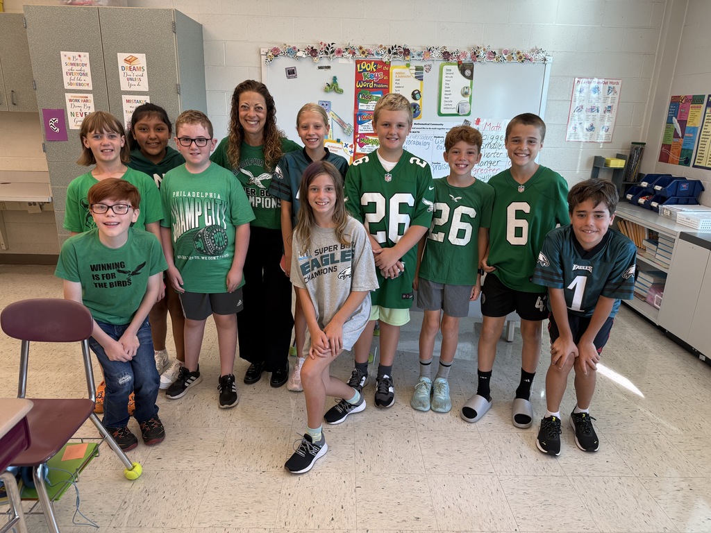 Students smiling in Eagles gear