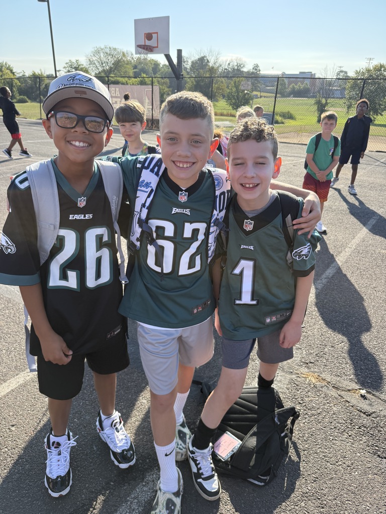 Students smiling in Eagles gear