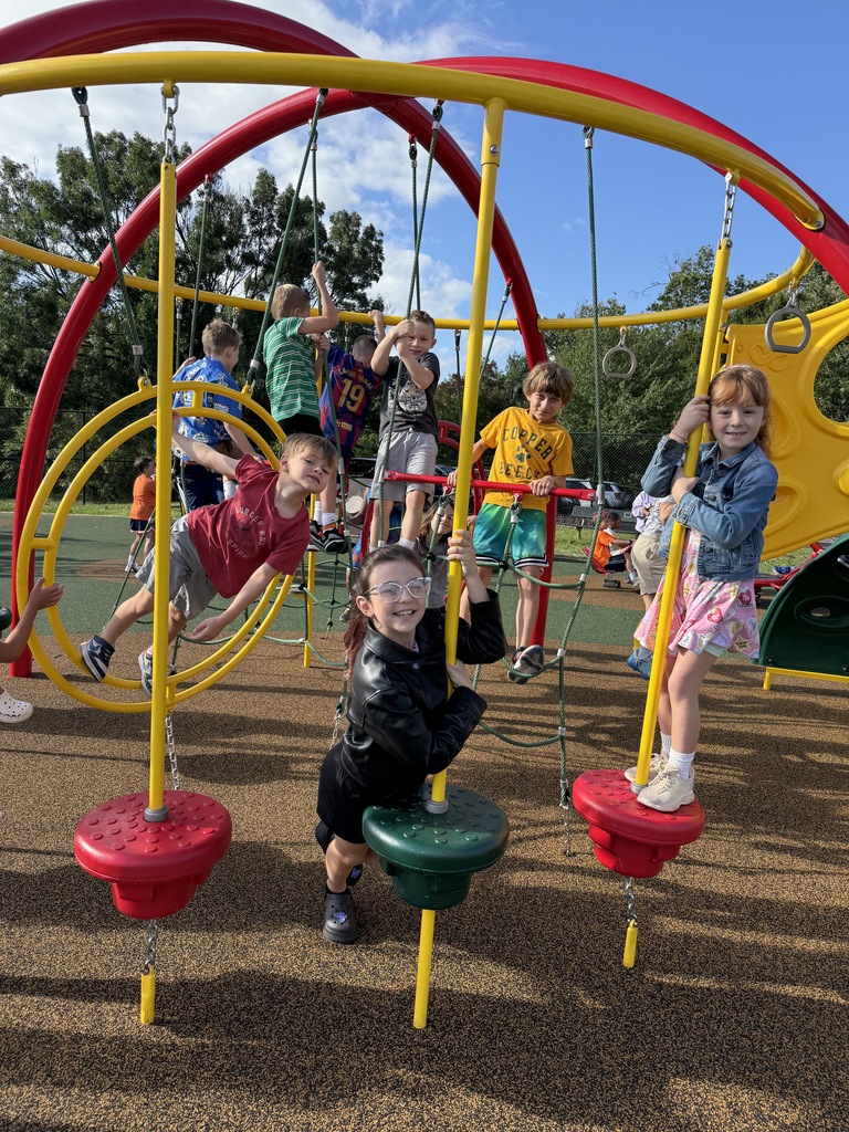 students smiling during the first week of school on the playground