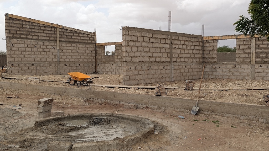 The open walls of the new building while under construction