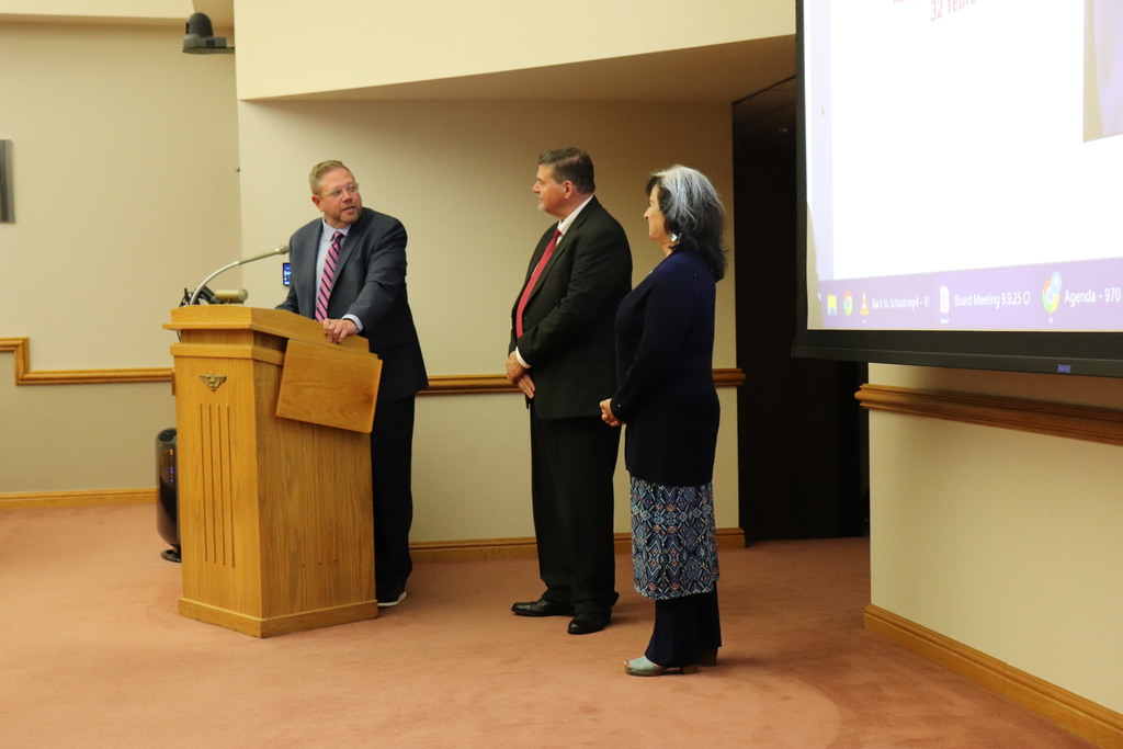 Dr. Fecher recognizing Mr. Lionetti alongside Dr. Mowry at the Board meeting