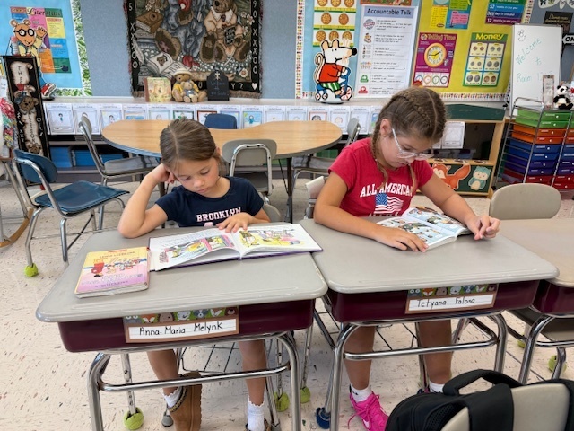 Students reading their books.