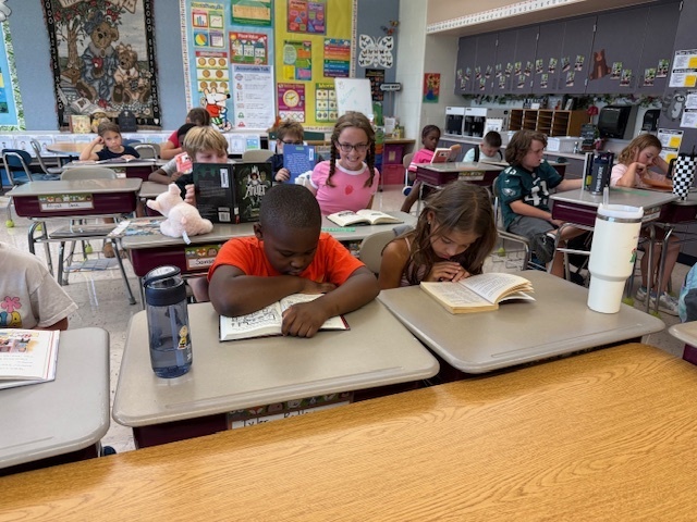 Students reading their books.