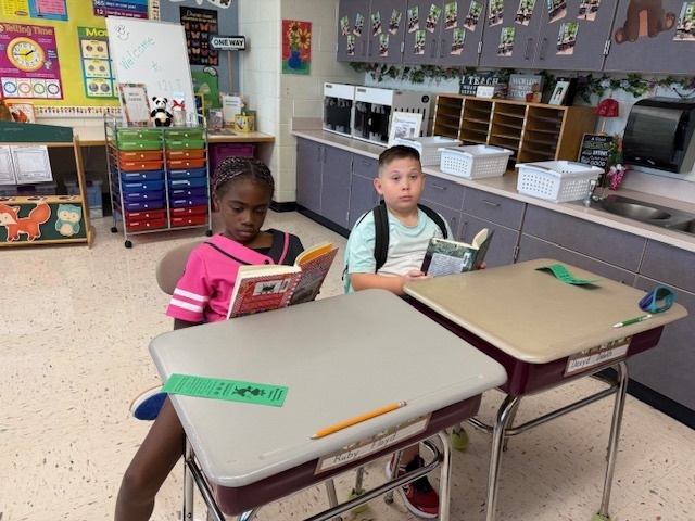 Students reading their books.