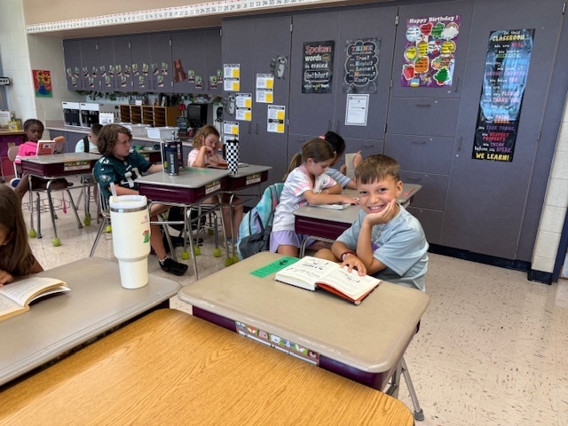 Students reading their books.
