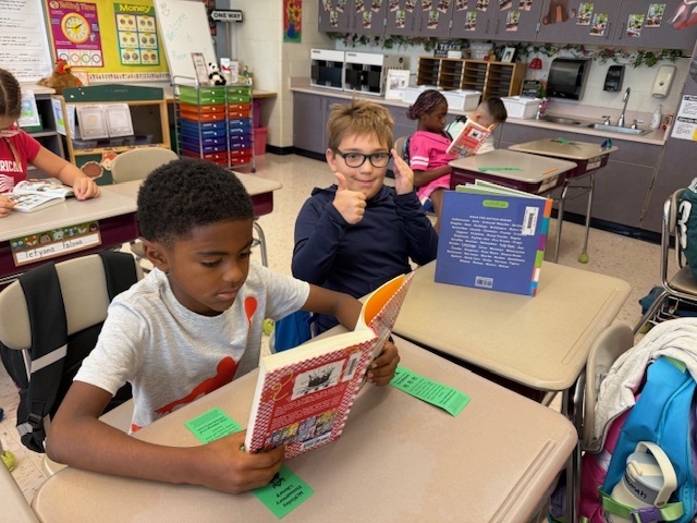 Students reading their books.