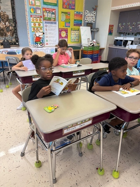 Students reading their books.
